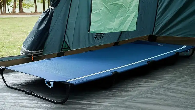 How Can I Make My Camping Cot More Comfortable - top picture showing a cot in a tent.