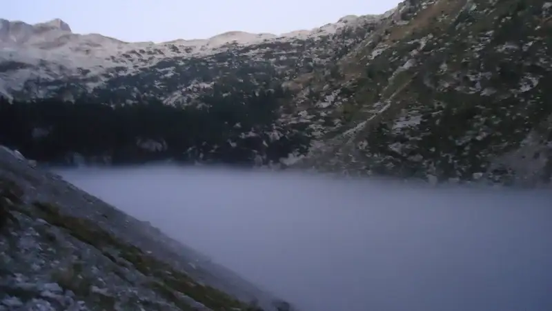 This is a cloud of fog created during the night above a mountain lake.